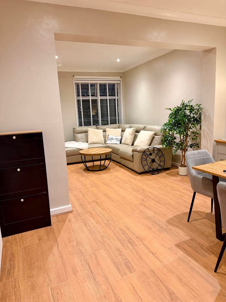 Oak effect flooring in an open plan living room