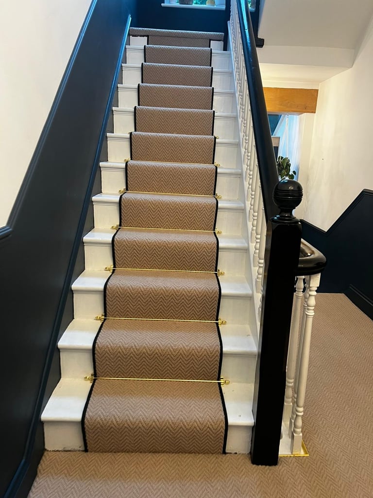 Herringbone stair runner with brass stair rods